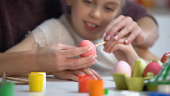 Mother Teaching Daughter to Paint Easter Eggs Brush, Family Holiday Traditions