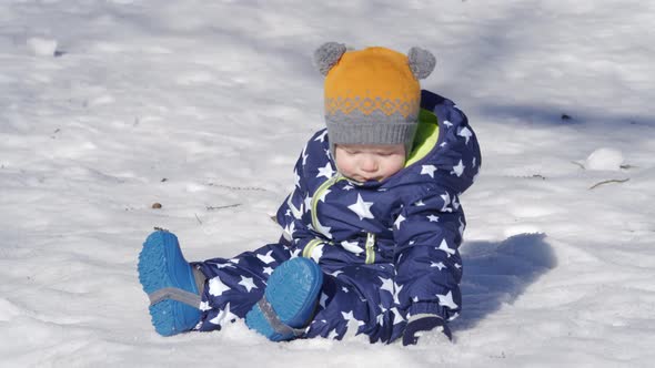 Baby Playing in the Snow in Winter 1 Year Old Baby Boy on a Walk in the Park