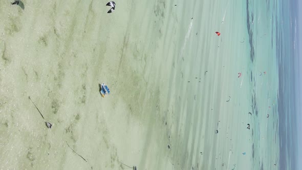 Zanzibar Tanzania  Vertical Video Kitesurfing Near the Shore of Ocean Slow Motion