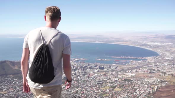 Slow Motion: Man on Table Mountain Enjoys Beautiful View of Cape Town