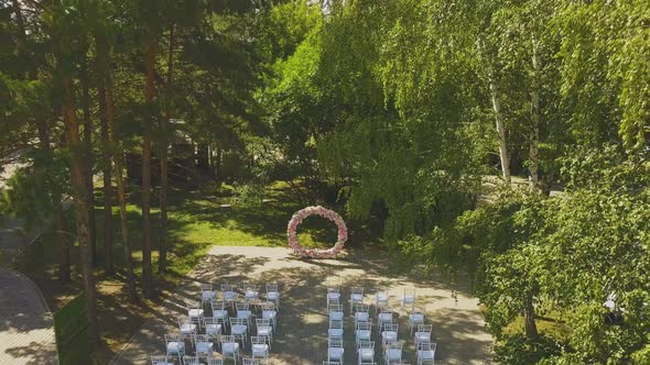 Wedding Venue with Pink Flower Garland in Park Aerial View