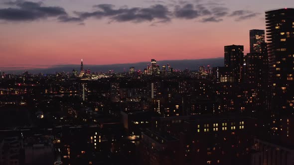 Landing Footage of City Lights Against Dusk Sky