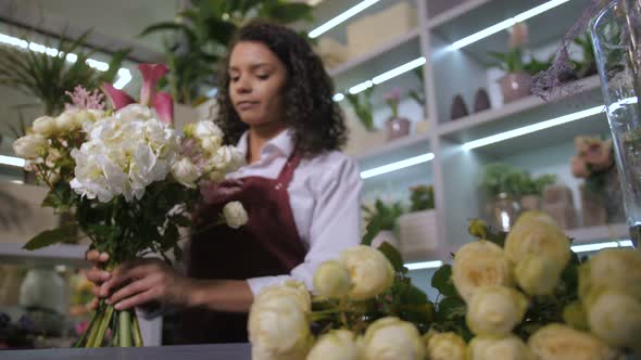 Young Florist Making Beautiful Flower Arrangement