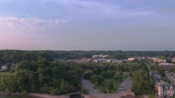 Lake Erie beach front park, facing south, showing green trees, residential neighborhoods and office