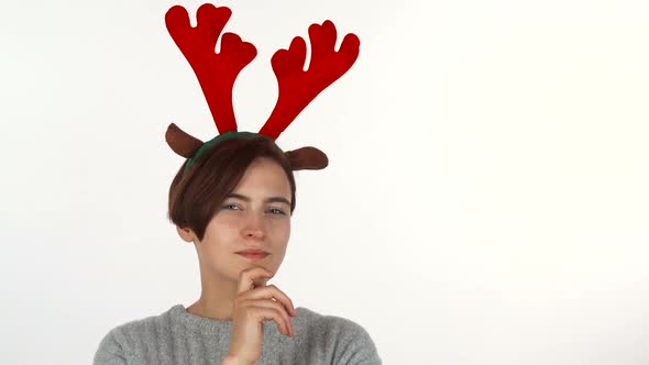 Attractive Christmas Girl Looking Thoughtfully To the Camera, Isolated 1080p