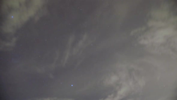 Night time sky timelapse, stars above clouds