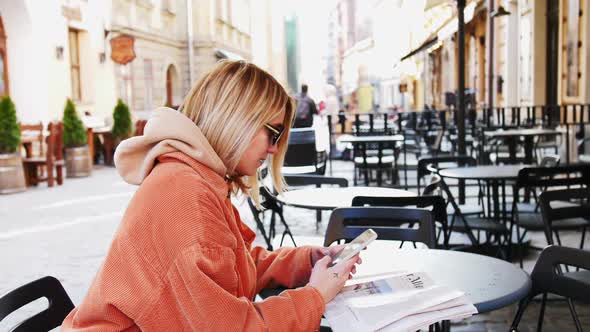 Beautiful Young Businesswoman Wearing White Shirt and Using Modern Smartphone