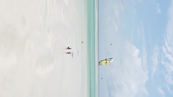 Zanzibar Tanzania  Vertical Video Kitesurfing Near the Shore of Ocean Slow Motion