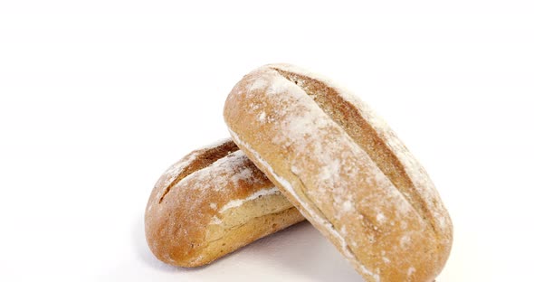 Two bread loaves on white background