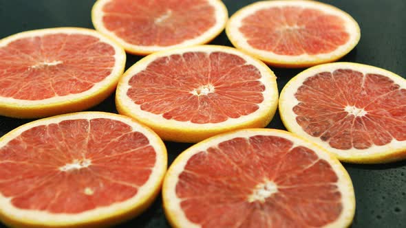 Slices of Grapefruit on Table 