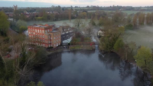 Drone footage over Dedham Mill at sunrise towards Dedham.