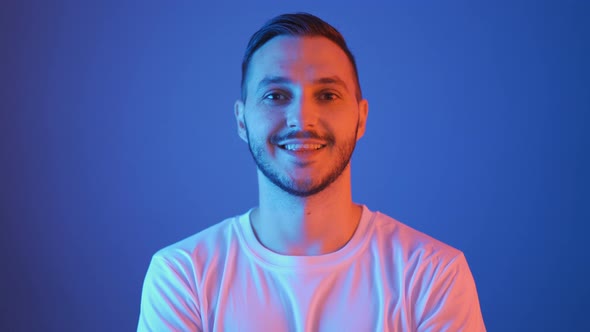 Portrait of Smiling Football Fan with Red and Blue Lights