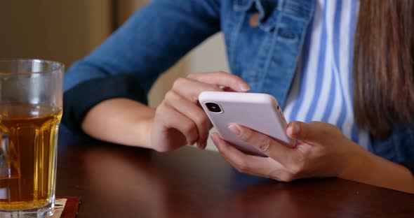 Woman use of mobile phone at home