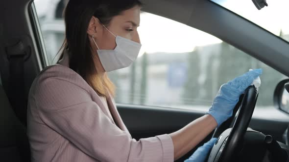 Protective Equipment for Preventing Covid19 Infection Woman is Wiping Steering Wheel
