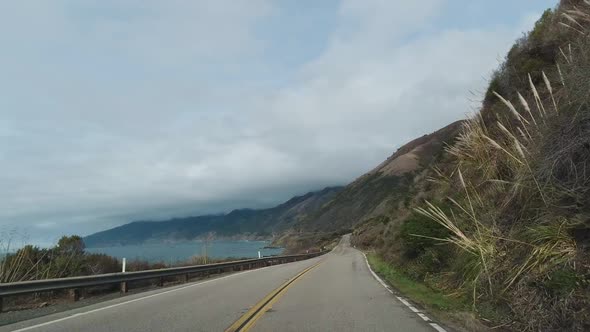 Driving Car on Pacific Coast Highway. Big Sur, California. USA