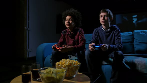 Concentrated Teen Gamers Playing Home Console