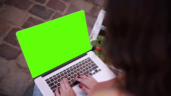 In the Background the Woman's Hands are Working on the Mock Up Screen Computer