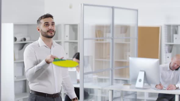 Young Colleague Playing Ping-Pong Alone