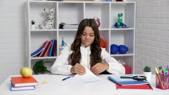 Angry Overworked Schoolgirl in School Uniform Throw Away Squeezed Paper Schoolwork