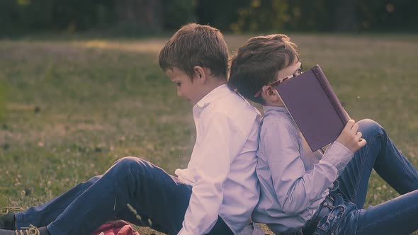 Student in Shirt Hides Behind Book and Pushes Back