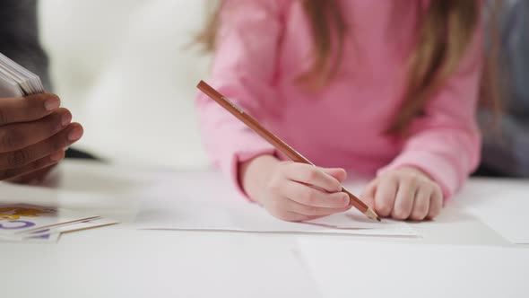 Girl Writes Letters Learning English Language with Teacher