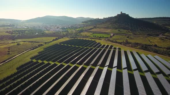 Aerial Top View of Solar Farm with Sunlight Cells for Producing Renewable Electricity