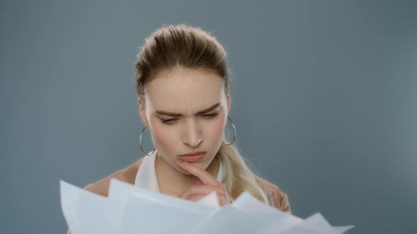 Annoyed Woman Throwing Papers in Slow Motion