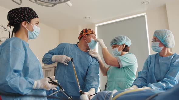 Surgical Team Working In Operating Theatre