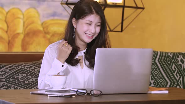 Beautiful Asian Girl Celebrate With Laptop