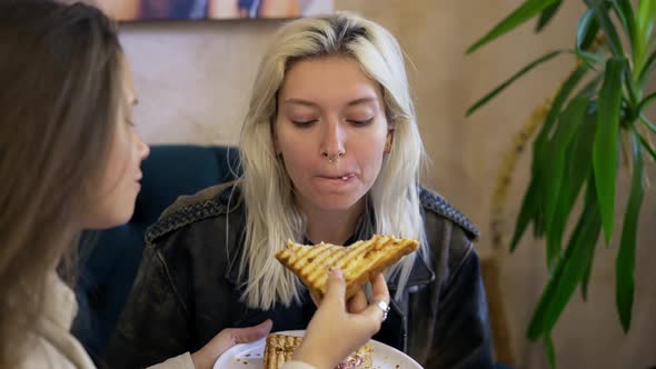 Cheerful Lesbian Girls Feeding Each Other Then Kissing