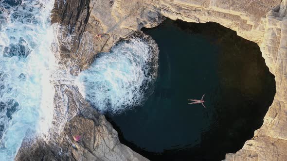 Above Aerial View of a Girl Floating and Swimming in Giola Sea Lagoon, Thassos, Greece