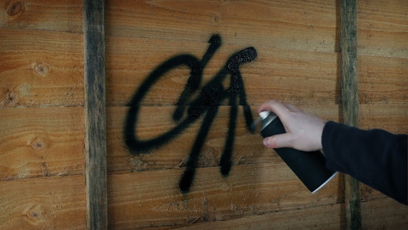 Vandal Tags Fence With Spray Paint