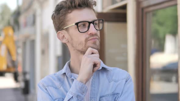 Man with Headache Standing Outdoor