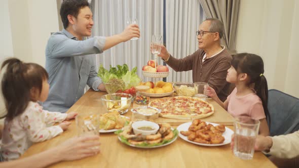 Happy family time and relationship, Asian big family having small party eating food together at home