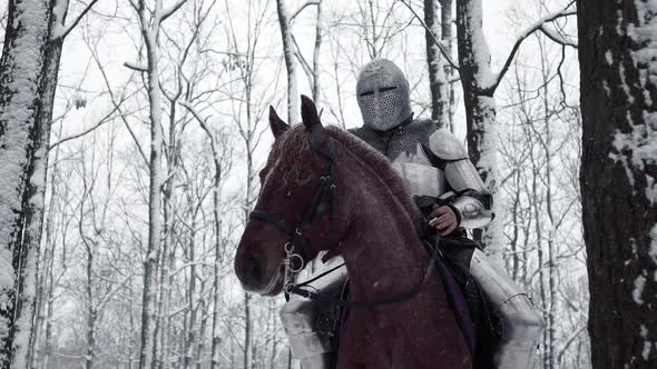 Portrait of Frightening Armed Knight Wearing Steel Protection and Helmet Being Horseback on