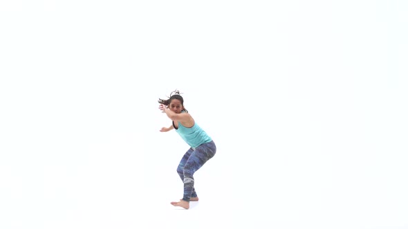 Females Is Practicing Capoeira in White Background of Studio. Afro-Brazilian Martial Art That
