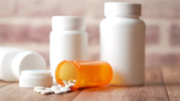 White Color Medical Pills Spilling on Table