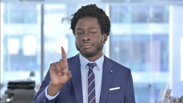 African American Businessman Saying No with Finger Sign