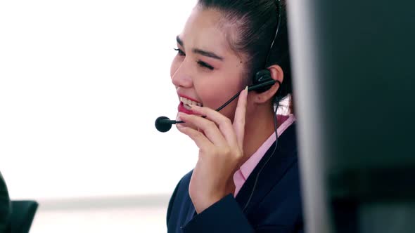 Business People Wearing Headset Working in Office