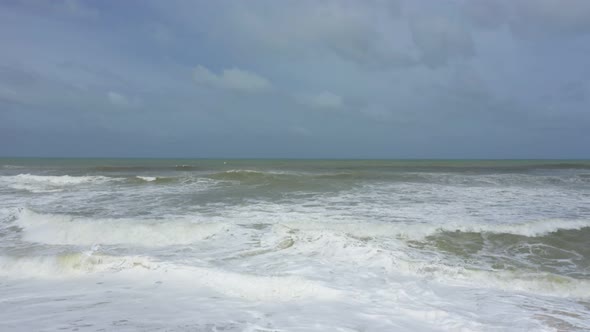 flying over the beach with waves