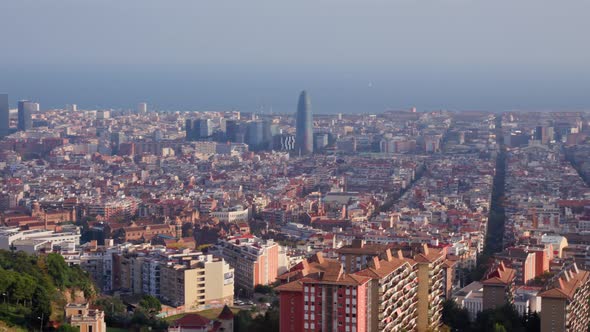 Panning panoramic shot over polluted barcelona skyline, famous mediterranean city in Spain. beautifu