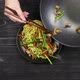 Stir Fried Noodles with Garlic Sprouts and with Chicken is laid out on a Plate - VideoHive Item for Sale