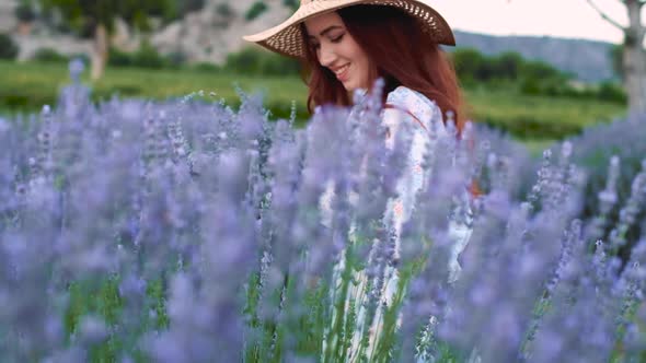 Woman Walking on Lavender Field