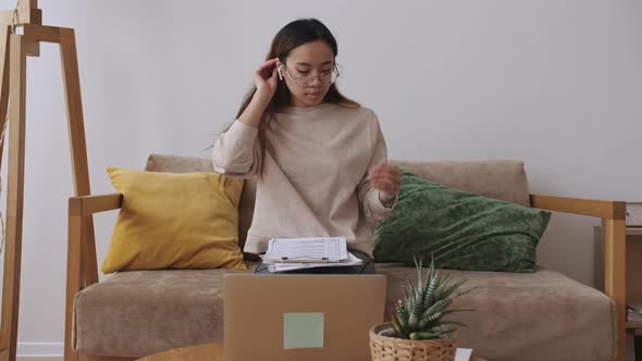 Middle Eastern Female Remote Working From Home Having a Video Call with Colleagues Checking