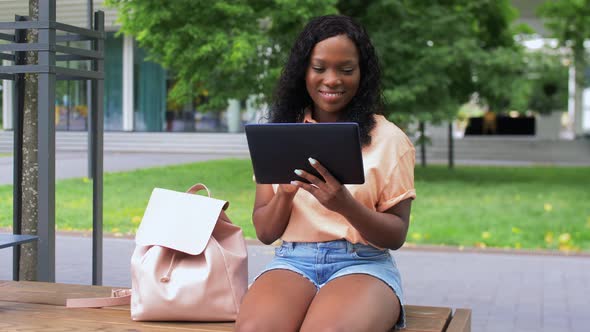 Happy African Student Girl with Tablet Pc in City