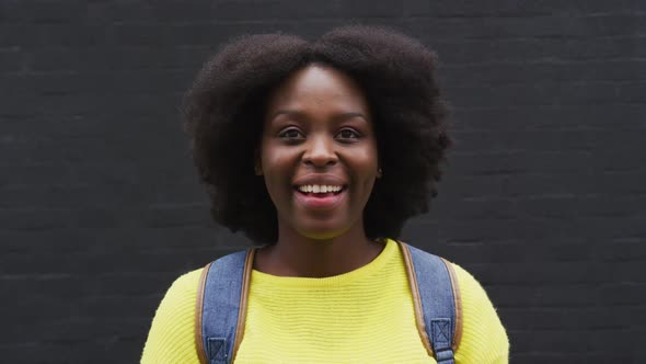 Portrait of african american, looking at the camera and smiling