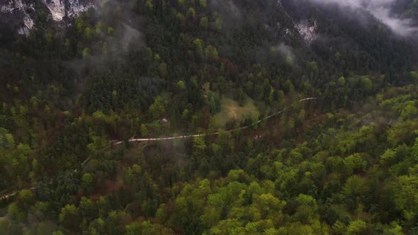 Flying over misty mountains and hills