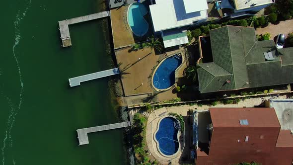 Looking down over luxury homes and jetties s at Surfers Paradise Gold Coast Australia