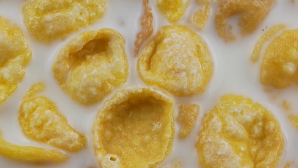 Cornflakes cereal and milk in a clay bowl. Morning breakfast.