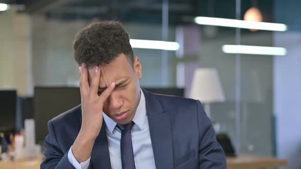 Portrait of Tired Young Businessman Having Headache